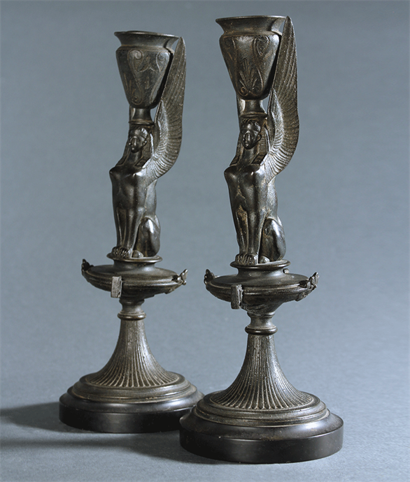 Picture of Pair of Egyptian Revival bronzed Sphinx candlesticks
