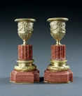 Picture of Decorative pair of Louis XVI ormolu and rose marble candlesticks