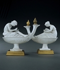 Picture of Decorative pair of biscuit porcelain figural oil lamps after Boizot